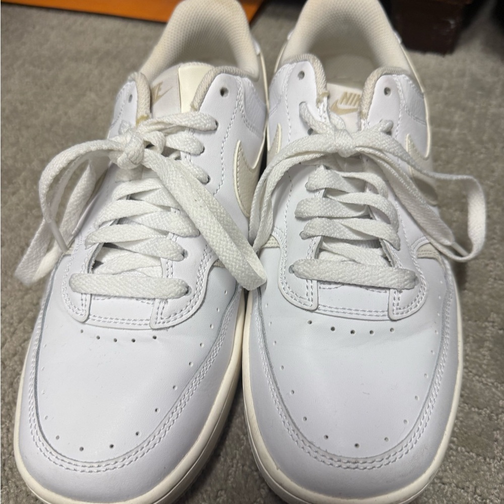 Nike women’s Air Force One White / cream Leather Sneakers
